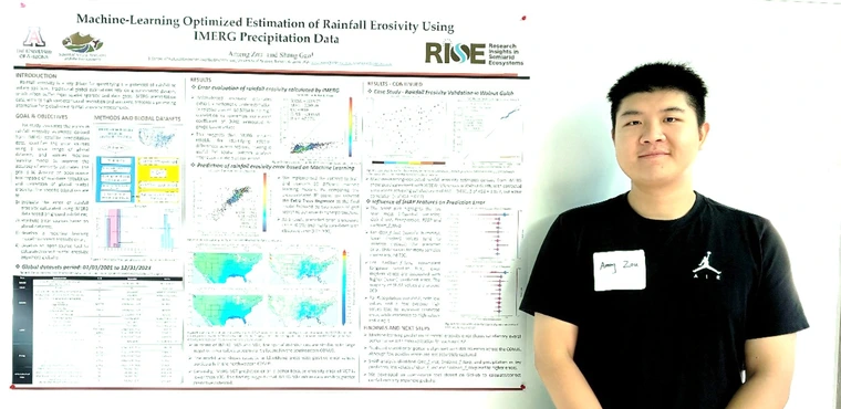 Ameng Zou next to his poster